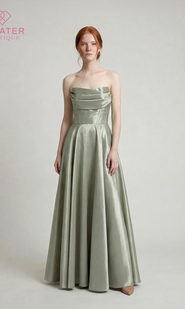 Robe DD7051 Minimaliste et élégante, la robe DD7051 sublime la silhouette avec son satin lumineux et sa coupe près du corps. Son bustier drapé sans bretelles apporte une touche sophistiquée, tandis que la fente discrète sur la jambe ajoute juste ce qu’il faut de féminité et d’allure. Une robe intemporelle parfaite pour les soirées, cérémonies et événements chic.